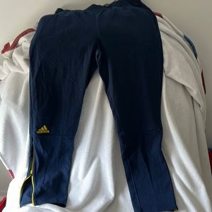 Navy and yellow adidas pants
